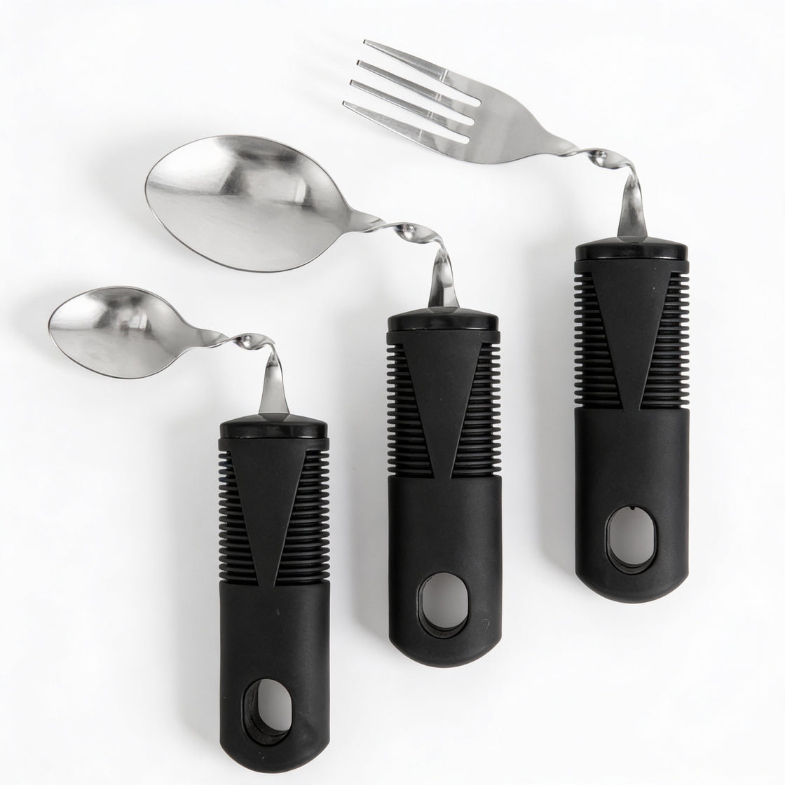 Adaptive cutlery set with ergonomic black handles, including fork and spoons with angled stainless steel heads