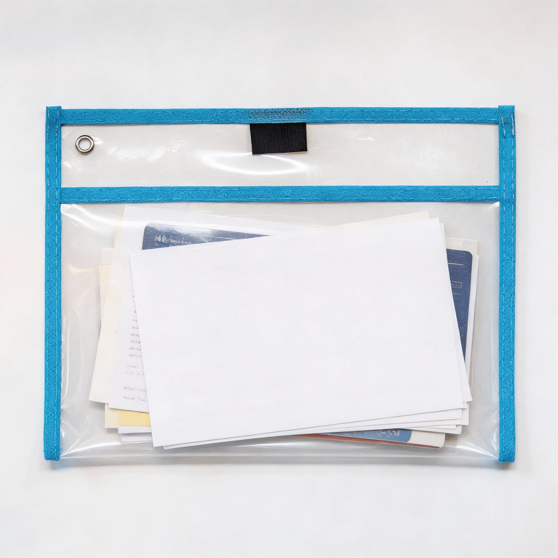 Clear waterproof dry pocket holding documents and papers